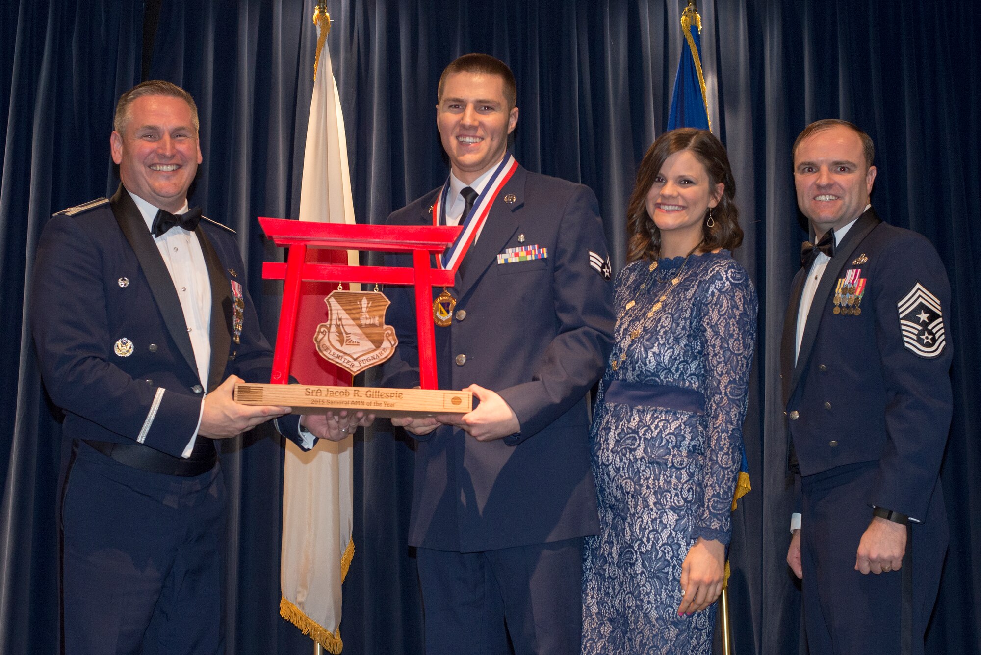 Senior Airman Jacob Gillespie, 374th Medical Group, receives the 2015 Samurai Airman of the Year Award for the 374th Airlift Wing at Yokota Air Base, Japan, Feb. 19, 2016. (U.S. Air Force photo by Senior Airman David Danford/Released)