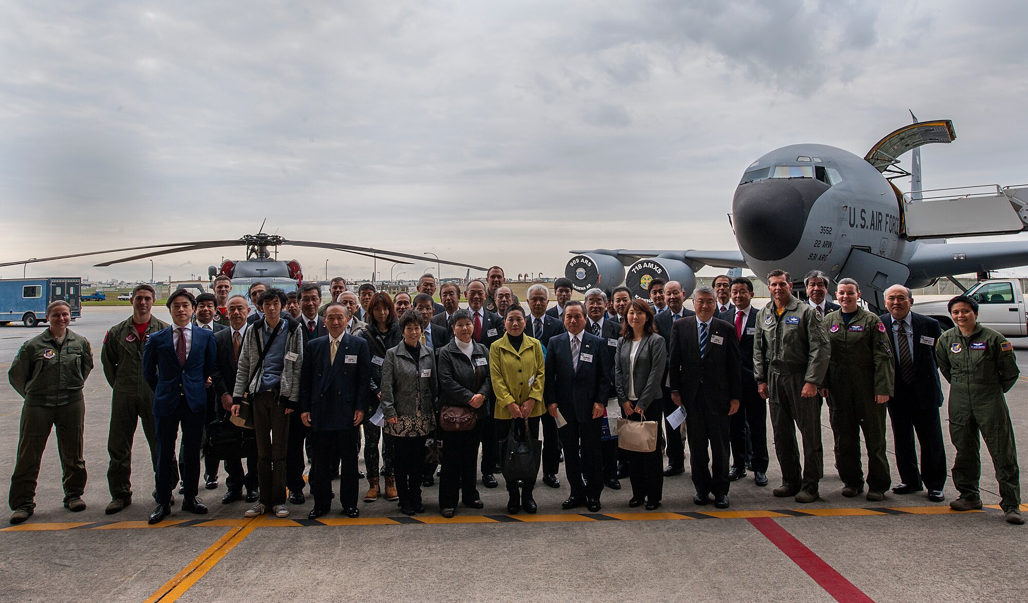 Japan-American Air Force Goodwill Association members tour a KC-135 Stratotanker and a HH-60 Pavehawk Feb. 26, 2016, at Kadena Air Base, Japan. JAAGA members toured different aircraft and received briefs to better understand Kadena’s mission and capabilities to build relations. (U.S. Air Force photo by Airman 1st Class Corey M. Pettis)