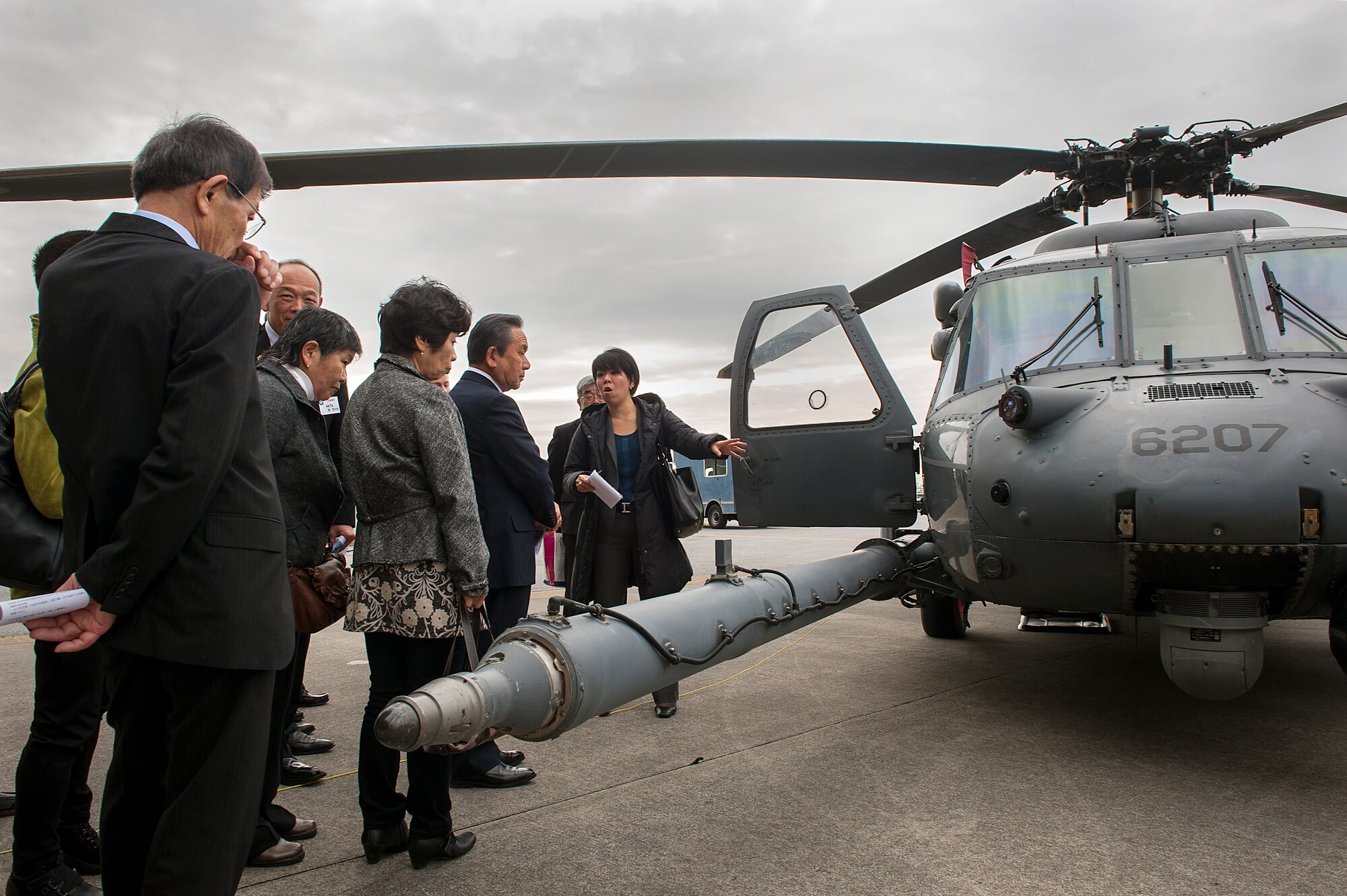 Members of the Japan-American Air Force Goodwill Association tour an HH-60 Pavehawk and learn about its capabilities Feb. 26, 2016, at Kadena Air Base, Japan. JAAGA is an organization aimed at building ties with the U.S. Air Force and leaders in the Japanese community. (U.S. Air Force photo by Airman 1st Class Corey M. Pettis)