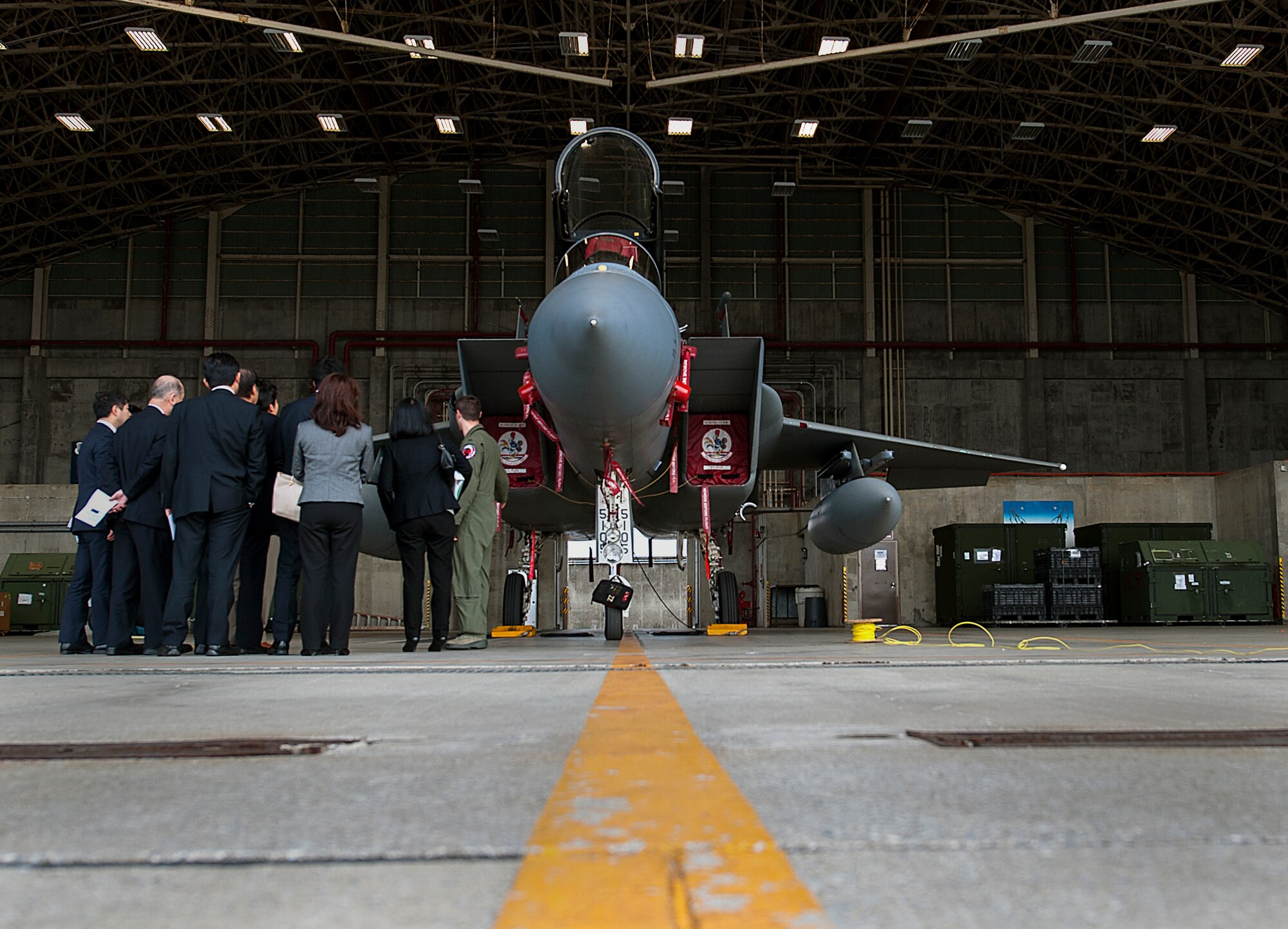 Members of the Japan-American Air Force Goodwill Association learn about the capabilities of the F-15 Eagle during a base tour Feb. 26, 2016, at Kadena Air Base, Japan. JAAGA, an organization made up of Japan Air Self-Defense Force and community leaders, received mission briefs and a tour of the base in an effort to better understand the mission and capabilities of Kadena. (U.S. Air Force photo by Airman 1st Class Corey M. Pettis)