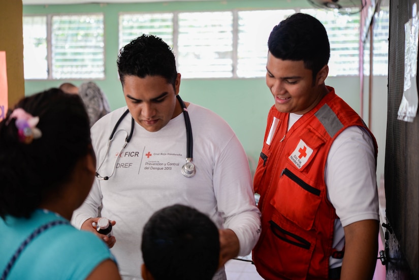 Roy Broonfield, Red Cross volunteer, helps hands out prescribed medication during a Medical Readiness Training Exercise in the Cortes Department, Honduras, Feb. 19, 2016. Broonfield helped members of the U.S. Army by translating prescriptions and questions the locals had about their medication during the two day MEDRETE. The exercise helps support the Honduran Ministry of Health and provides locals with basic medical attention they would otherwise not receive. (U.S. Air Force photo by Staff Sgt. Westin Warburton/Released)