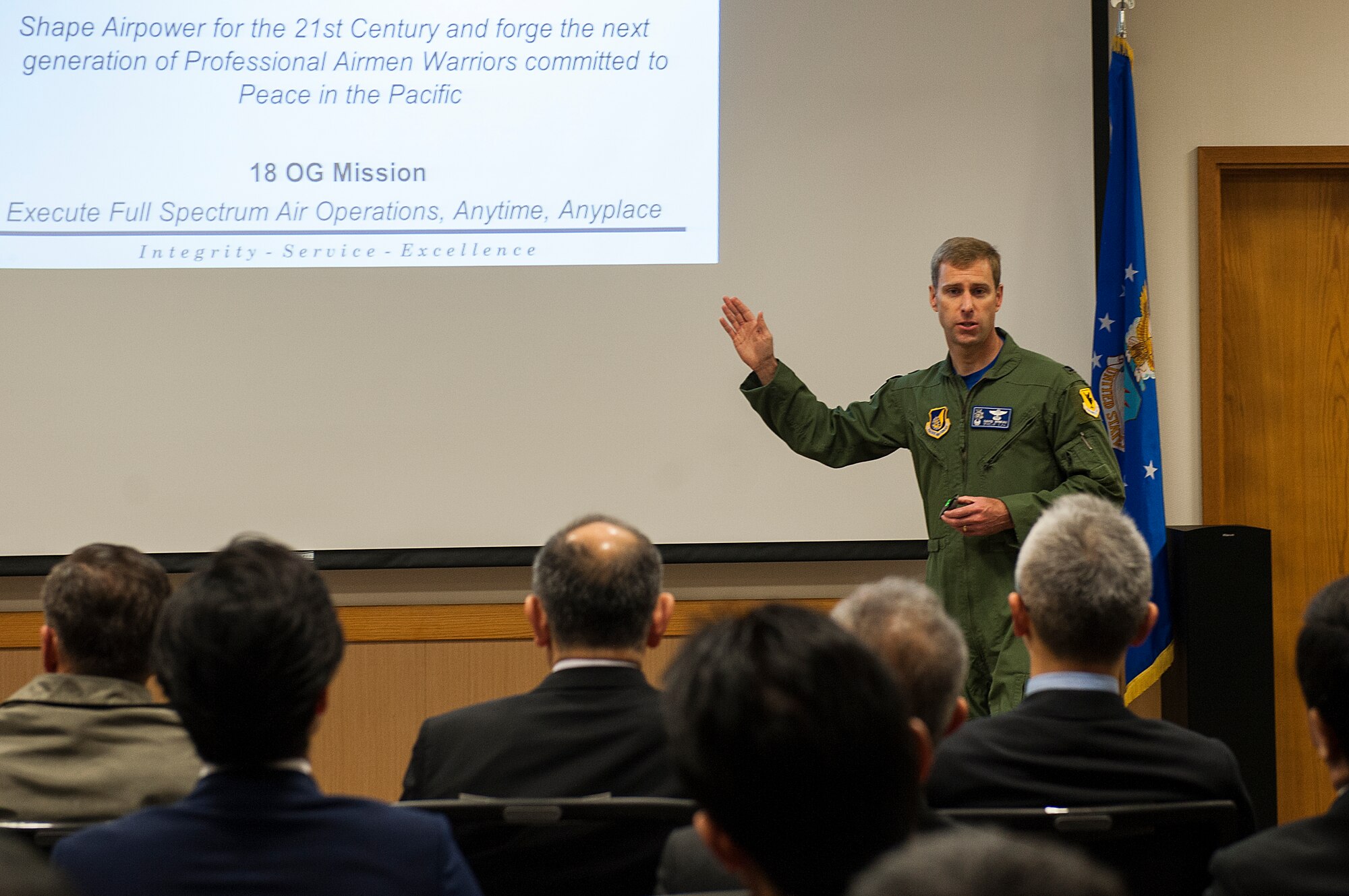 U.S. Air Force Col. David Mineau, 18th Operations Group commander, briefs Japan-American Air Force Goodwill Association members on the mission and capabilities of the 18th Wing Feb. 26, 2016, at Kadena Air Base, Japan. JAAGA is a private organization comprised of high ranking members of Japan Air Self-Defense Force and community leaders with the goal of strengthening U.S.-Japan ties. (U.S. Air Force photo by Airman 1st Class Corey M. Pettis)