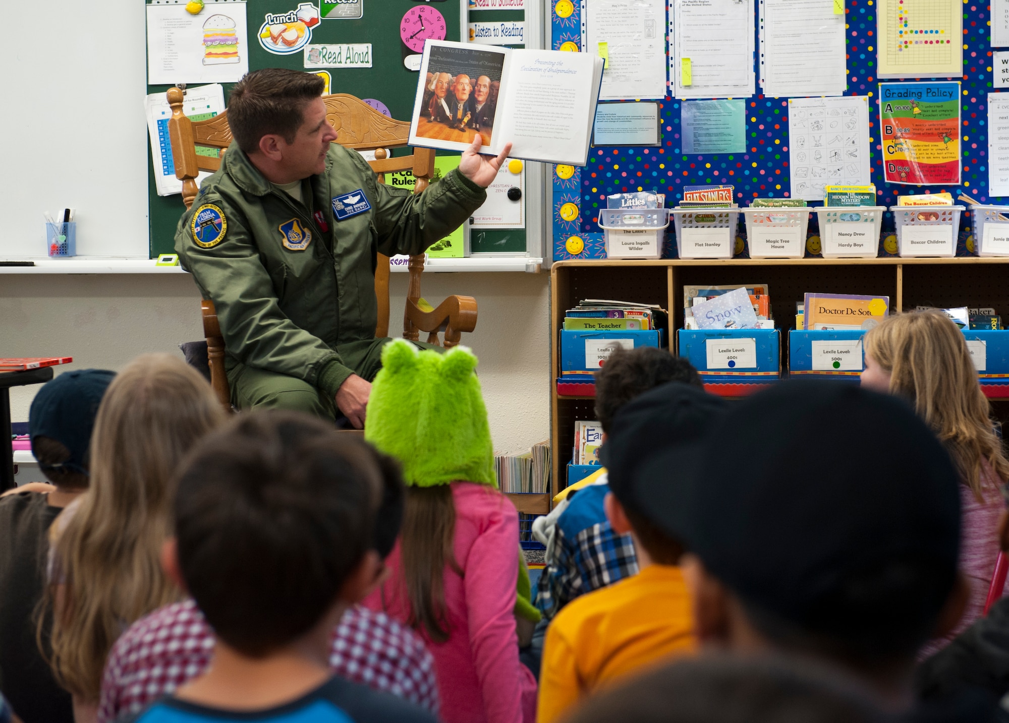 U.S. Air Force Col. Christopher Amrhein, 18th Wing vice commander, reads to students of Amelia Earhart Intermediate School during the Read Across America campaign, Feb. 29, 2016, at Kadena Air Base, Japan. Read Across America is an observance of Dr. Seuss’s birthday with a goal of motivating children and teens to read through events, partnerships and reading resources. (U.S. Air Force photo by Airman Zackary A. Henry)