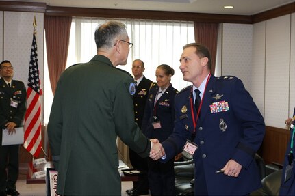 U.S. Air Force Maj. Gen. Clinton E. Crosier, U.S. Strategic Command (USSTRATCOM) director of plans and policy (right), shakes hands with Japanese Ground Defense Force Maj. Gen. Takayuki Onozuka, Japanâ€™s Joint Staff Defense Plans and Policy Department director general, prior to an office call at Japanâ€™s Ministry of Defense (MOD) Headquarters in Tokyo, Japan, Feb. 29, 2016. While there, Crosier met with Onozuka, Japanese Maritime Self-Defense Force Adm. Katsutoshi Kawano, Japanâ€™s Joint Staff chief of staff, and other leaders to discuss space, cyber, and missile defense as part of an ongoing collaborative effort by USSTRATCOM and Japanâ€™s MOD to continue growing their partnership. He also toured Japan Aerospace Exploration Agency (JAXA) facilities to review the progress on JAXA's ability to integrate with USSTRATCOMâ€™s Joint Space Operations Center (JSpOC) and to improve on Japanese sensor integration. One of nine DoD unified combatant commands, USSTRATCOM has global strategic missions, assigned through the Unified Command Plan, which include strategic deterrence; space operations; cyberspace operations; joint electronic warfare; global strike; missile defense; intelligence, surveillance and reconnaissance; combating weapons of mass destruction; and analysis and targeting. (Photo courtesy of Japan Ministry of Defense)