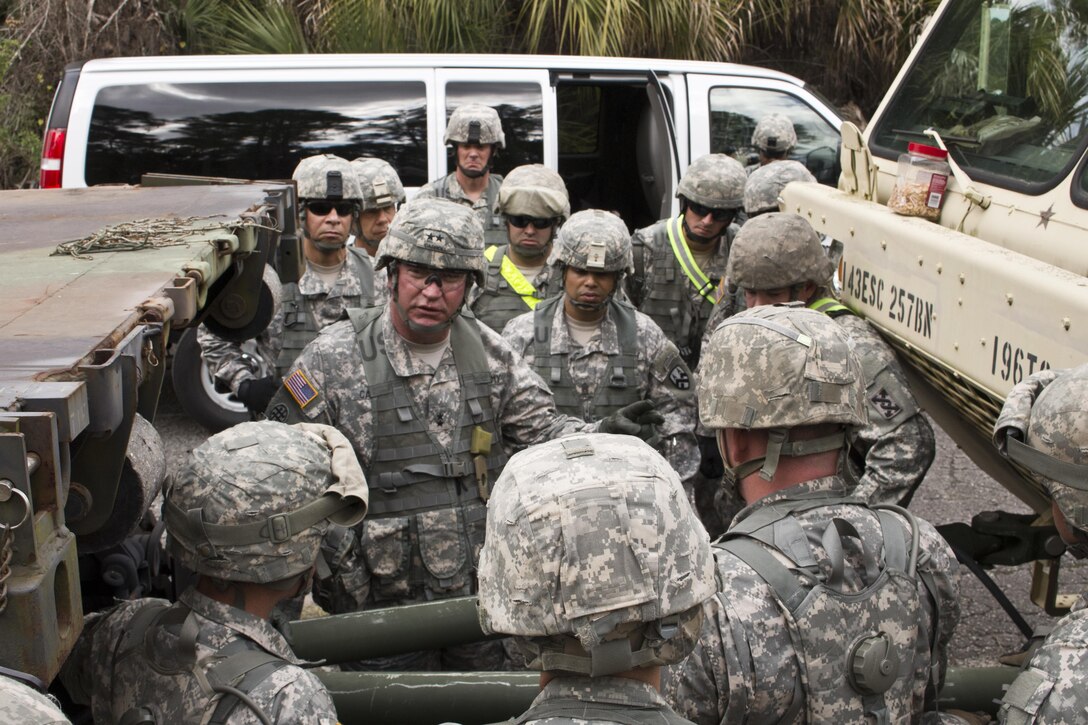 Army Maj. Gen. Les Carroll, commanding general, 377th Theater Sustainment Command, emphasizes the value of operating their equipment in field conditions to Army Reserve soldiers assigned to the 641st Regional Support Group Jan. 23, 2015, at the Air Force's Malabar Transmitter Annex in Malabar, Fla. Carroll and Army Brig. Gen. Francisco A. Espaillat, commanding general, 143rd Sustainment Command (Expeditionary), visited the site to see how approximately 950 Soldiers conducted various training events and competitions that tested their readiness and capabilities during Operation Responsive Sentinel, a multi-echelon training exercise organized by the 641st RSG. (U.S. Army Photo by Army Sgt. John L. Carkeet IV, 143rd Sustainment Command (Expeditionary))