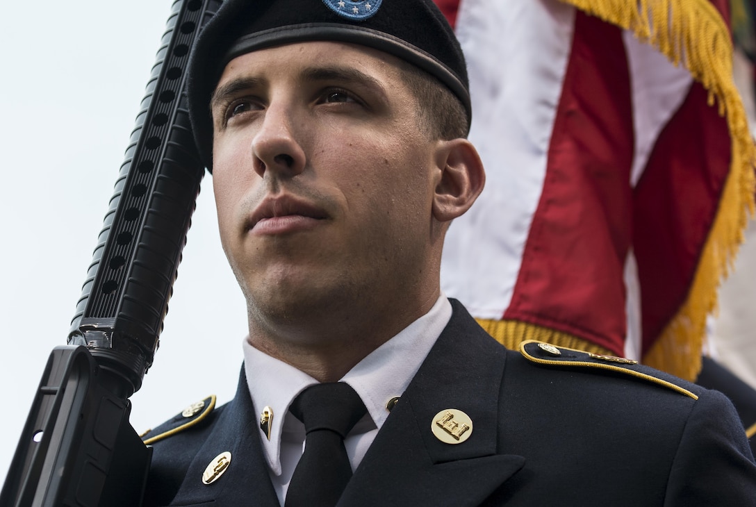 Spc. William McGuigan, Army Reserve color guard team member with the 416th Theater Engineer Command, holds a display rifle before presenting the colors at a Chicago Cubs game at Wrigley Field, June 25. The 416th TEC is headquartered just 30 miles driving distance from Wrigley Field and is responsible for more than 12,000 Army Reserve Soldiers in 27 different states. The color guard team members were Pudowski, Staff Sgt. Timothy Cooper, Sgt. Peter Garcia, McGuigan and Spc. Travis Gantz. (U.S. Army photo by Master Sgt. Michel Sauret)