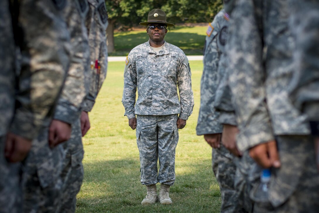 Army Reserve drill sergeant, Sgt. 1st Class Ervin Brewster, of Company C, 1st Bn., 518th Inf. Reg., 98th Training Div. (IET), inspects a formation of Clemson University Reserve Officer Training Corps cadets during a drill and ceremony lab that was being conducted by drill sergeants from the division, at Clemson University Sept. 3, 2015. (U.S. Army photo by Sgt. Ken Scar)