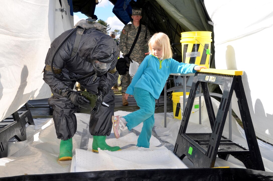 U.S. Army Reserve Soldiers with the 388th Chemical Biological Radiological Nuclear Company, out of Junction City, Wis., participated in a joint training exercise at the Stevens Point Municipal Airport Oct. 3, 2015. The 409th Area Support Medical Company out of Madison, Wis. and local Stevens Point and Portage County officials participated and observed. Local civilians volunteered to role play as casualties, including a family with two small children, bringing a new level of realism to this exercise and giving Soldiers real world experience in the delicate handling of children in mass casualty decontamination scenarios. The joint exercise gave everyone involved a chance to experience what their role would be in a real world emergency. Army Reserve Soldiers play a supporting role to the local officials, so it is vital to learn how to communicate and coordinate across organizations.