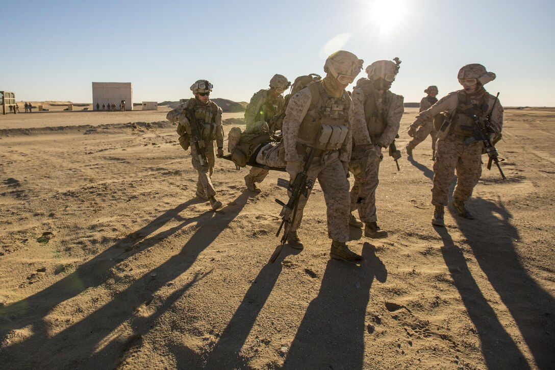 U.S. Marines carry a simulated casualty during a tactical exercise to recover aircraft and personnel at an undisclosed location in Southwest Asia, Dec. 28, 2015. The Marines are assigned to 1st Battalion, 7th Marine Regiment, Special Purpose Marine Air-Ground Task Force-Crisis Response Central Command. U.S. Marine Corps photo by Lance Cpl. Clarence Leake