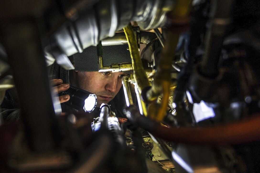 U.S. Air Force Staff Sgt. Michael White inspects the inside of a C-130J engine on Little Rock Air Force Base, Ark., Dec. 29, 2015. White, an aerospace propulsion journeyman assigned to the 19th Maintenance Squadron, ensured the engine was free from foreign object debris such as rubber, metal or leaves. U.S Air Force photo by Senior Airman Harry Brexel