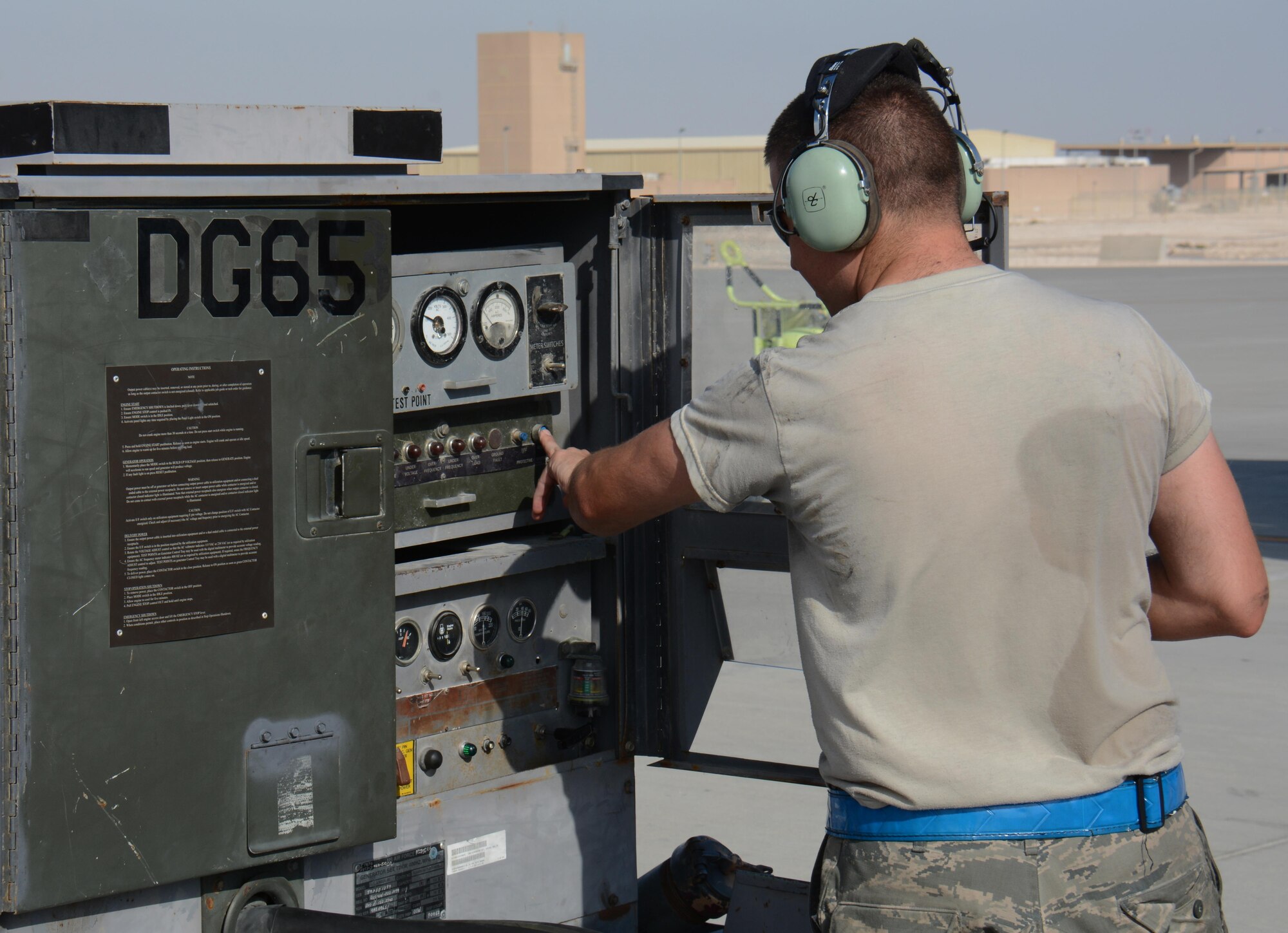 Senior Airman Reid Nixon, 340th Expeditionary Aircraft Maintenance Unit hydraulics journeyman from Odenton, Maryland, turns on an external power cart to supply power to a KC-135 Stratotanker at Al Udeid Air Base, Qatar, Dec. 30, 2015. Nixon and several airmen from the 340th EAMU hydraulics team installed a multi-purpose refueling system on the aircraft so the plane can refuel any airframe supporting Operation Inherent Resolve. After installing the system Reid and his hydraulics team conducted an inspection of the system. (U.S. Air Force photo by Tech. Sgt. James Hodgman/Released)