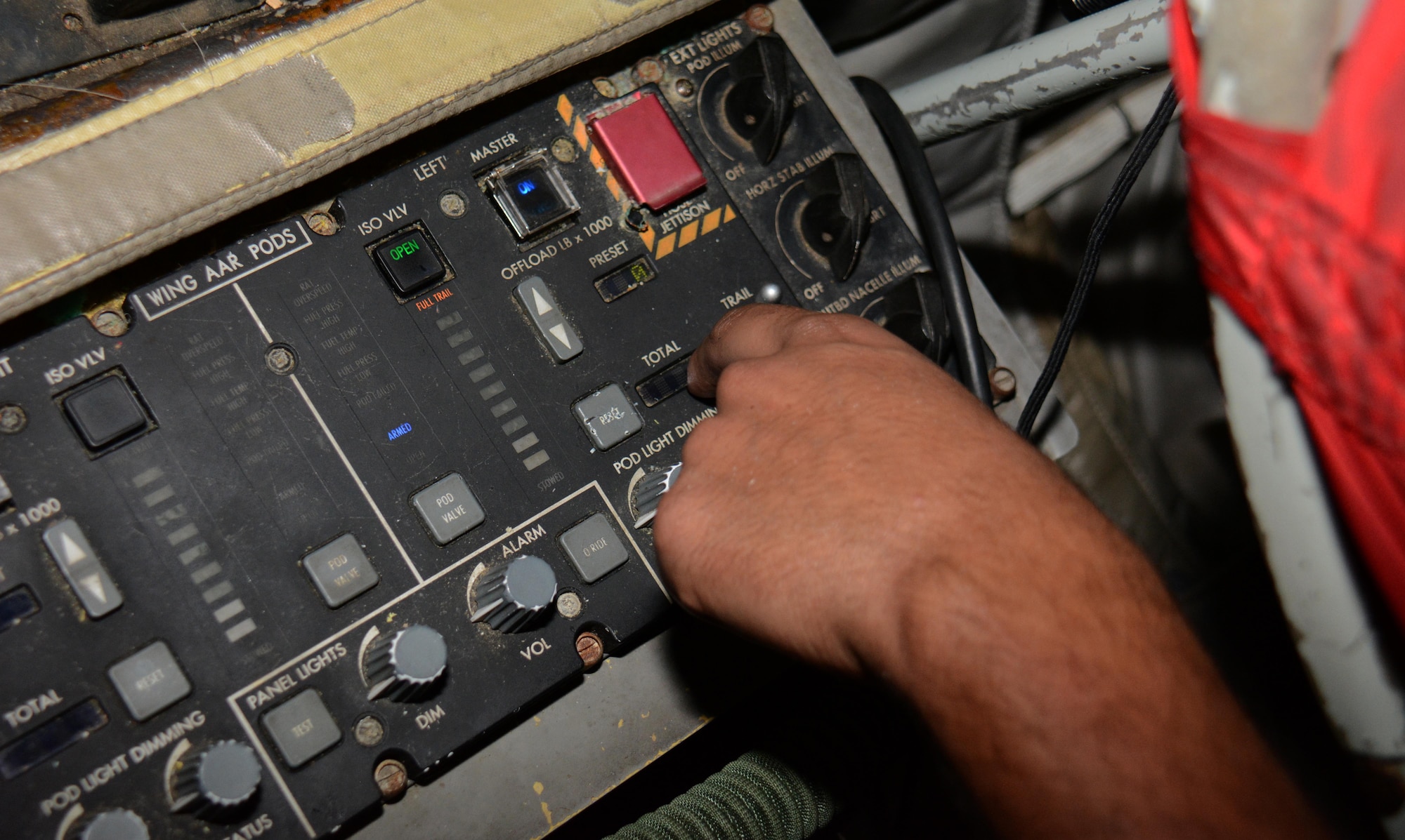 Senior Airman Michael Velazquez, 340th Expeditionary Aircraft Maintenance Unit hydraulics journeyman from Rochester, New York, opens an isolation valve and prepares the multi-purpose refueling system to send fuel to the pod during an inspection of the system at Al Udeid Air Base, Qatar, Dec. 30, 2015. Velazquez and several airmen from the 340th EAMU hydraulics team installed the system on the aircraft so the plane can refuel any airframe supporting Operation Inherent Resolve. (U.S. Air Force photo by Tech. Sgt. James Hodgman/Released)