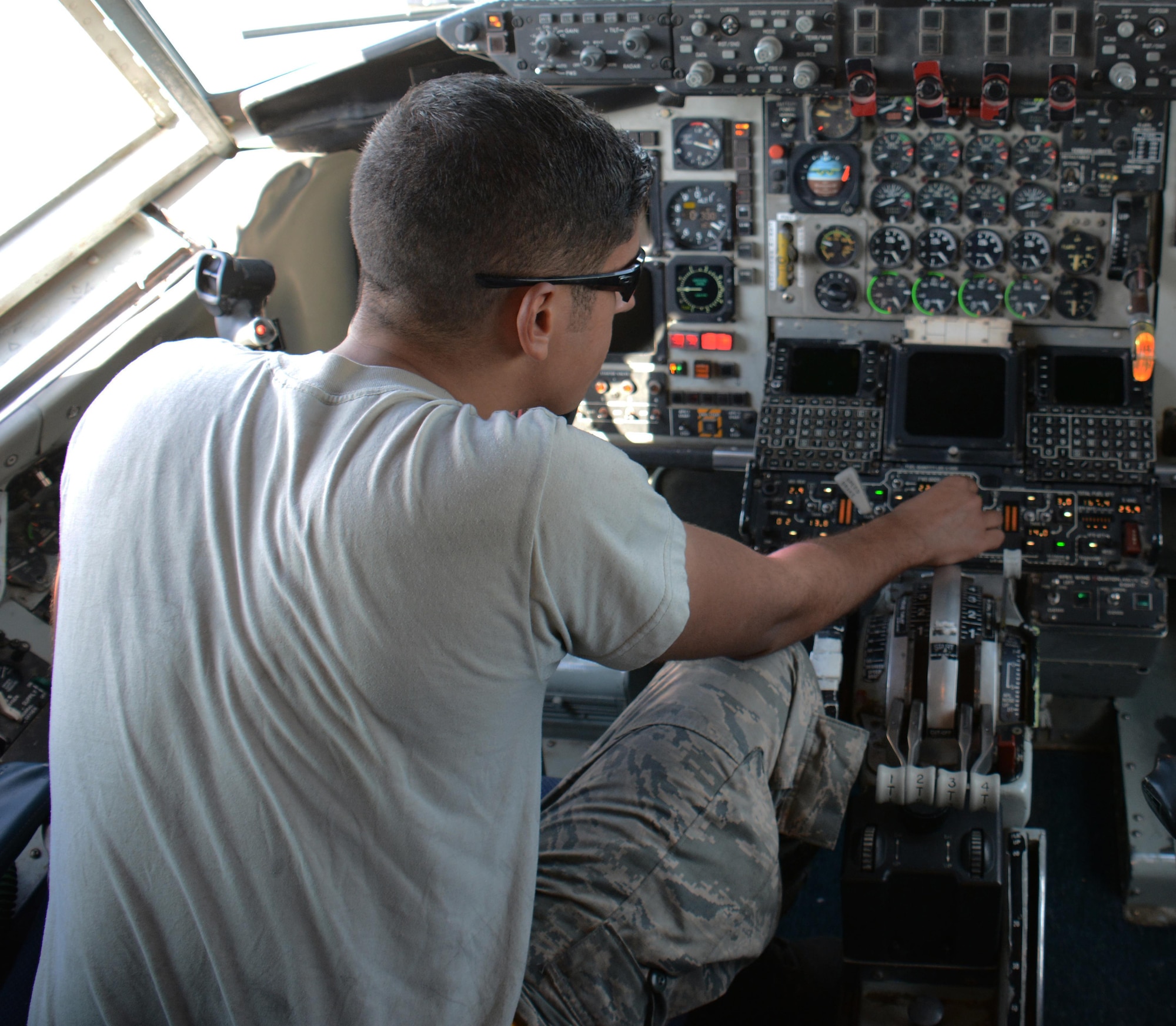 Senior Airman Michael Velazquez, 340th Expeditionary Aircraft Maintenance Unit hydraulics journeyman from Rochester, New York, turns on the center wing boost pumps inside the cockpit of a KC-135 Stratotanker after installing a multi-purpose refueling system on the aircraft at Al Udeid Air Base, Qatar, Dec. 30, 2015. Velazquez and several airmen from the 340th EAMU hydraulics team installed the system on the aircraft so the plane can refuel any airframe supporting Operation Inherent Resolve. (U.S. Air Force photo by Tech. Sgt. James Hodgman/Released)