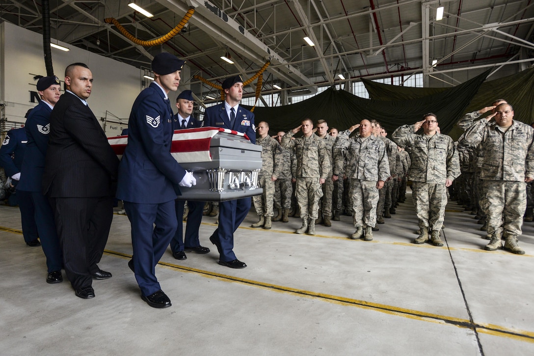 Pallbearers from the 105th Airlift Wing carry the casket of Air Force Staff Sgt. Louis Bonacasa during a dignified transfer of remains on F.S. Gabreski Air National Guard Base, N.Y., Dec. 31, 2015. Bonacasa, one of six airmen killed during a vehicle bomb attack in Afghanistan, was a former member of the 106th Rescue Wing. U.S. Air National Guard photo by Staff Sgt. Christopher S. Muncy 