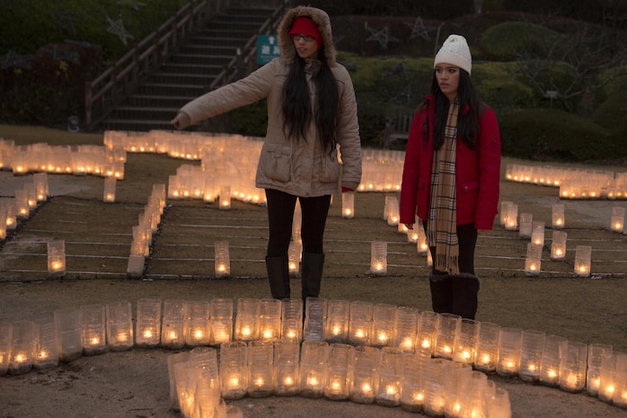 Haily Galarza, left, and Michelle Vazquez, program assistants with the Youth and Teen Center at Marine Corps Air Station Iwakuni view a candle display at the Hiroshima Botanical Garden in Hiroshima City, Japan, Dec. 23, 2015. Residents were provided the opportunity to take group photos with a giant wreath, enjoy illuminated dinosaurs and the maze of light.