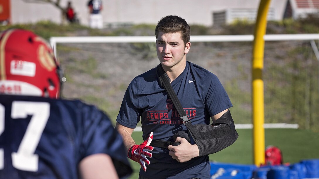 JoJo Domann, outside linebacker from Pine Creek High School, Colorado Springs, Colo., helps run drills during practice at Orange Coast College, Costa Mesa, California, Jan. 1, 2016. High School athletes chosen to play in the Semper Fidelis All-American Bowl are well-rounded individuals on and off the field who not only are distinguished athletes, but also have academic achievements and display exemplary moral character.