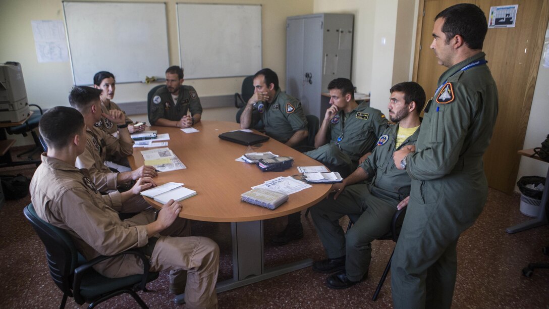 U.S. Marines with Special-Purpose Marine Air-Ground Task Force Crisis Response-Africa coordinate an aerial refueling mission with pilots from the Spanish Air Force, Aug. 13, at Morón Air Base, Spain. Five Spanish Eurofighter Typhoons and a KC-130J Hercules from SPMAGTF-CR-AF successfully conducted a refueling of the Spanish aircraft for the first time highlighting a mutual commitment to working together as allies.