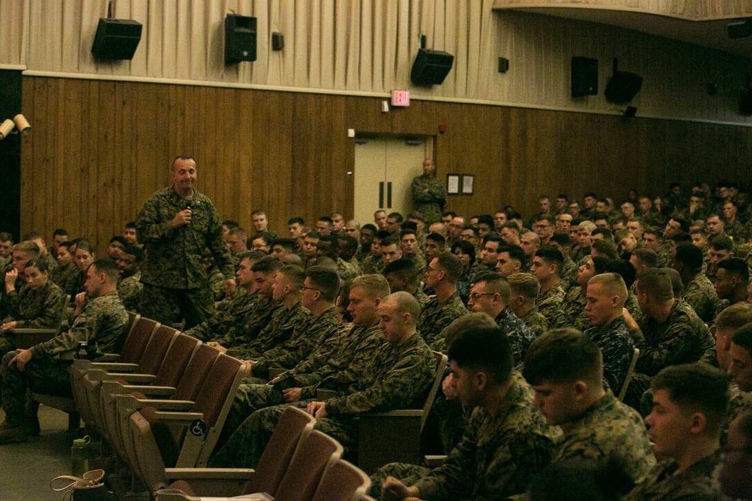 Brigadier General Charles G. Chiarotti, the commanding general of 2nd Marine Logistics Group, speaks to service members with the 2nd MLG, during a suicide prevention and awareness brief at the base theater at Camp Lejeune, N.C. Dec. 14, 2015. The 2nd MLG conducted the presentation in order to create a command climate of prevention of suicides, suicide attempts and ideations through education and guided discussion. With an estimated national average of 22 veteran suicides a day, these briefs are designed to raise awareness among members of the military. (U.S. Marine Corps photo by Lance Cpl. Damarko Bones/released)