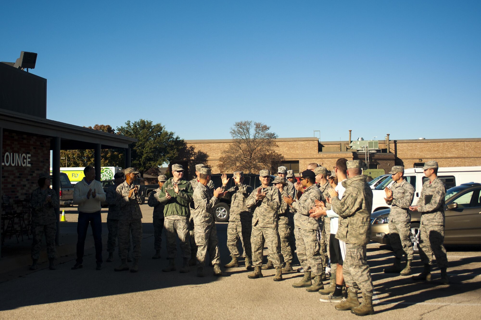 Base members gather outside the opening of the Avenger’s Lounge on Goodfellow Air Force Base, Texas, Dec. 18, 2015. The Avenger’s Lounge is a new facility for permanent party members to hang out, relax and to call their own. The decision to make the Avenger’s Lounge came from the junior enlisted Airmen who worked with Command Chief Master Sgt. JoAnne S. Bass, 17th Training Wing Command Chief, and the dorm housing office. (U.S. Air Force photo by Senior Airman Scott Jackson/released)