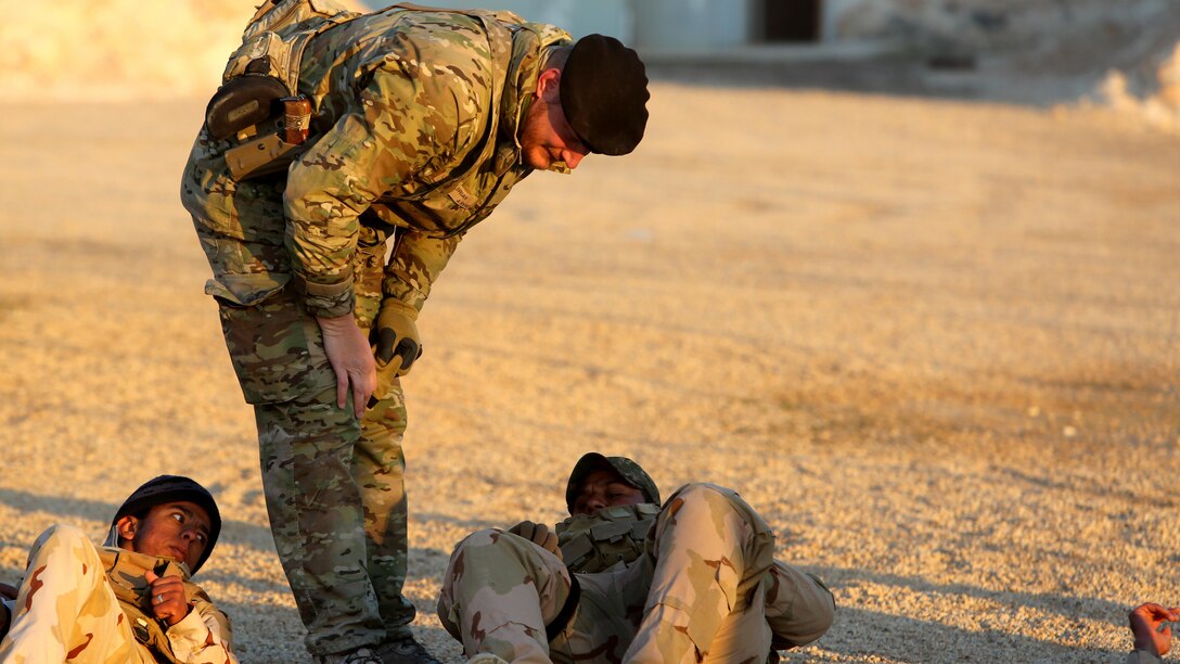 A member of the Royal Danish Army, attached to Task Force Al Asad, checks to see if an Iraqi soldiers has applied a tourniquet properly during a combat life savers course at Al Asad Air Base, Iraq, Dec. 29. 2015.  The task force has trained approximately 2,700 Iraqi soldiers with the 7th Iraqi Army Division through the building partner capacity program. By enabling Iraqi Security Forces through advise and assist, and building partner capacity missions, the Combined Joint Task Force - Operation Inherent Resolve’s multinational coalition is helping the Government of Iraq to set the conditions to defeat the Islamic State of Iraq and the Levant.