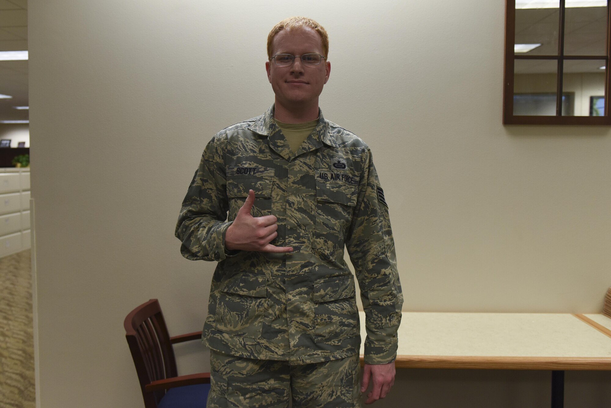 U.S. Air Force Staff Sgt. Scott G. Aaron, 315th Training Squadron intel instructor's New Years Resolution is “to spend more time with my kids.” (U.S. Air Force photo by Airman Chase Sousa/Released)
