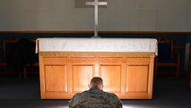 Tech. Sgt. Timothy Boyer, 56th Fighter Wing Public Affairs photojournalist, bows his head in prayer at the base chapel at Luke Air Force Base, Ariz., Nov. 9, 2015. Spirituality is one of the four pillars of Comprehensive Airman Fitness. Spiritual fitness is about having a sense of purpose and meaning in your life. 