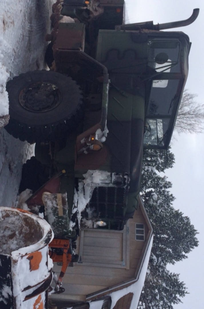 A former Army 5-ton tractor truck acquired by the Torrance County, New Mexico Sheriff’s Department through the DLA Law Enforcement Support Office waits for its next mission Dec. 26. Repurposed with a snowplow, the rig was used to reach isolated rural residents of the county in the wake of heavy snow from Winter Storm Goliath.