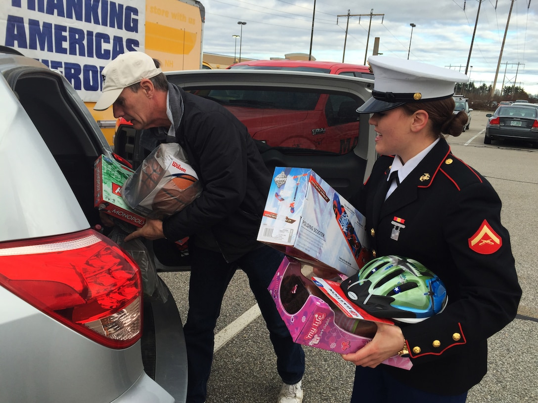Lance Cpl. Lindsey Shephard helps unload toy donations from the trunk of a car during the Marine Toys for Tots drive in Newington, NH, Dec. 4. The drive is a three-day collaborative event between the area’s recruiting and reserve units and local radio stations to collect and deliver toys to the local Toys for Tots warehouse for delivery to families. Shephard is a field wireman with Marine Wing Support Squadron 271, Marine Aircraft Group 14, and is currently on recruiter’s assistance with Recruiting Substation Dover, NH.