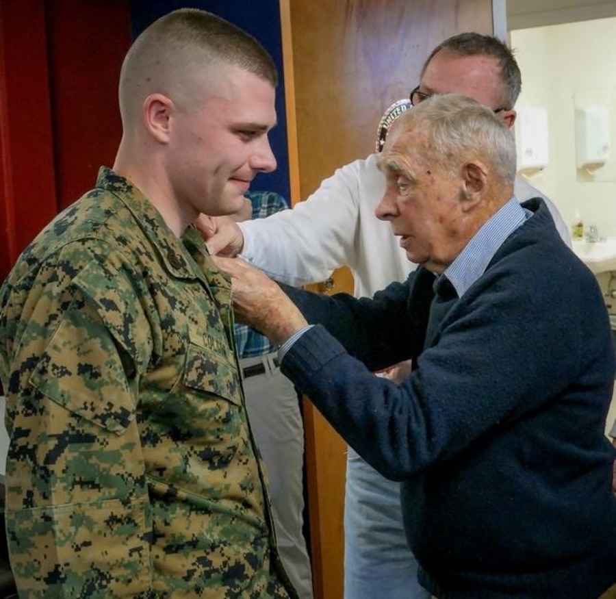 Robert Klare, former Marine staff sergeant and survivor of the attack of Pearl Harbor in World War II, promoted Sgt. Travis Colson to staff sergeant on the anniversary of the Pearl Harbor attack, Dec. 7. Klare, a resident of Colson's recruiting area of operation, wanted to promote the Marine to the rank he once was due to the camaraderie that the Marine Corps holds for all Marines, regardless of rank or age. Colson is staff noncommissioned officer-in-charge of Recruiting Substation Dover, New Hampshire.