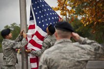 919th Special Operations Security Forces Squadron reservists raise the colors in front of the 919th Special Operations Wing headquarters building at Duke Field, Fla. Several Duke enlisted Airmen will move up to a higher rank in January. (U.S. Air Force photo/Tech. Sgt. Sam King)
