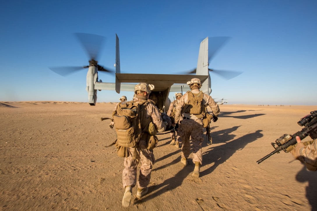U.S. Marines with 1st Battalion, 7th Marine Regiment, Special Purpose Marine Air-Ground Task Force-Crisis Response-Central Command, carry a simulated casualty toward an MV-22 Osprey with Marine Medium Tiltrotor Squadron 268, SPMAGTF-CR-CC, during a tactical recovery of aircraft and personnel exercise at an undisclosed location in Southwest Asia, Dec. 28, 2015. SPMAGTF-CR-CC is ready to respond to any crisis response mission in theater to include the employment of a TRAP force. 