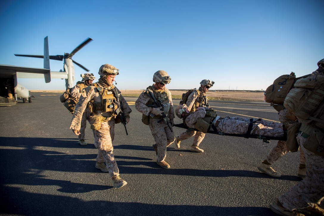U.S. Marines carry a simulated casualty off an MV-22 Osprey during a tactical recovery of aircraft and personnel exercise at an undisclosed location in Southwest Asia, Dec. 28, 2015. The Marines are assigned to the 1st Battalion, 7th Marine Regiment, Special Purpose Marine Air-Ground Task Force-Crisis Response-Central Command. U.S. Marine Corps photo by Lance Cpl. Clarence Leake