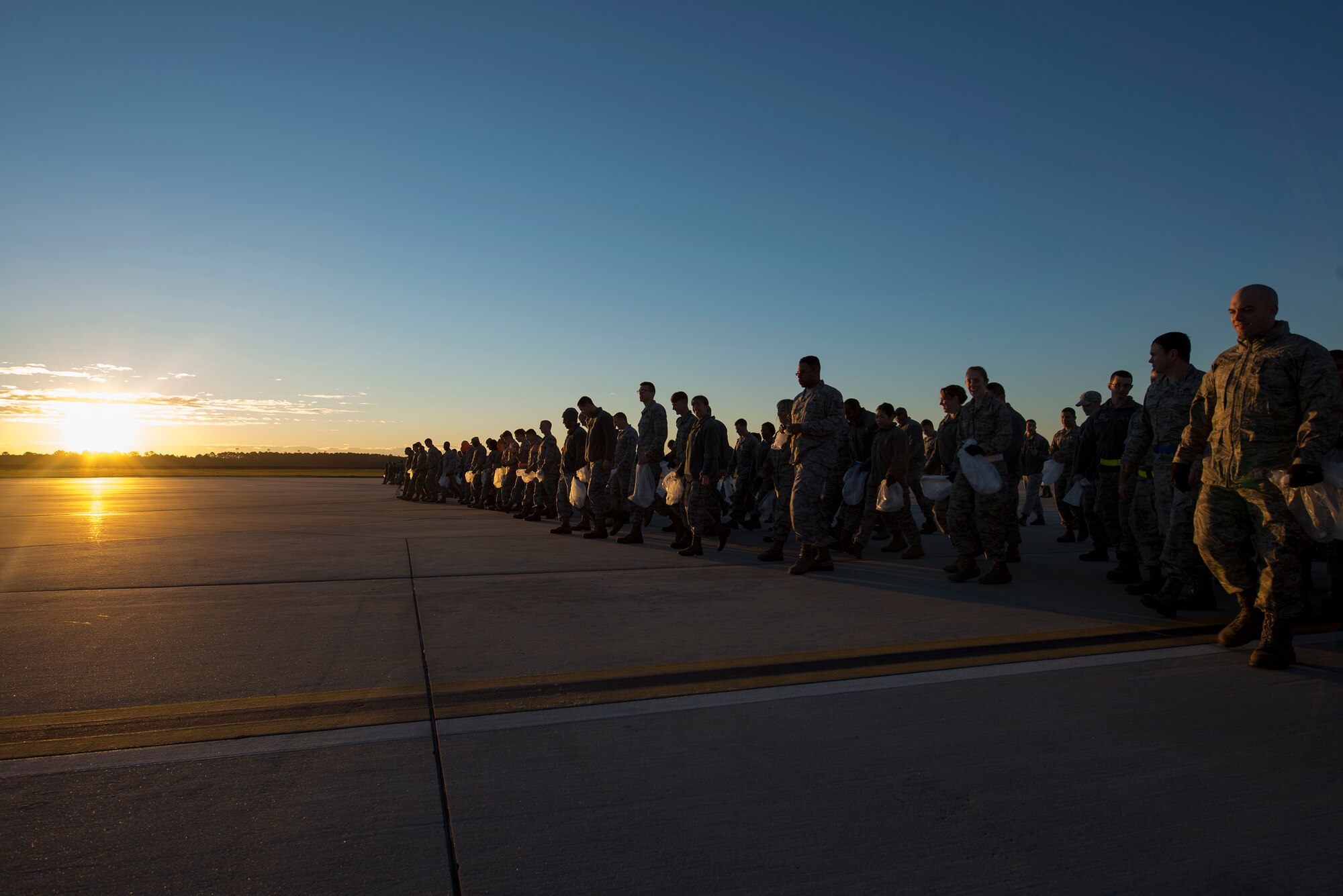 Airmen begin their trip down the flightline during the year’s first foreign object debris walk, Jan. 4, 2016, at Moody Air Force Base, Ga. FOD is any debris that could cause damage to aircraft such as loose gravel, metal, trash or rocks. (U.S. Air Force photo by Airman Daniel Snider/Released)