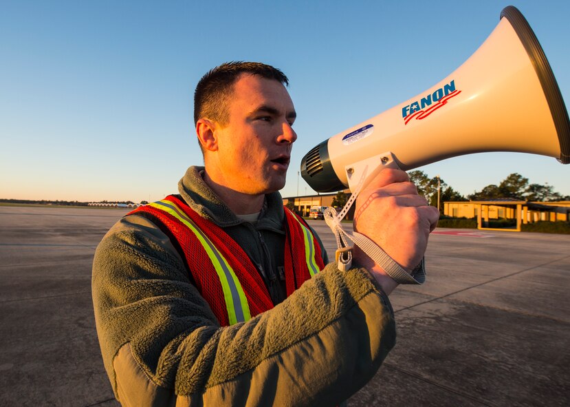 U.S. Air Force Tech. Sgt. Johnathan Chapman, 23d Maintenance Group quality assurance inspector, ensures order during the foreign object debris walk, Jan. 4, 2016, at Moody Air Force Base, Ga. Quality assurance Airmen ensured organization and proficiency among the 23d Wing’s Airmen throughout the walk. (U.S. Air Force photo by Senior Airman Ceaira Tinsley/Released)