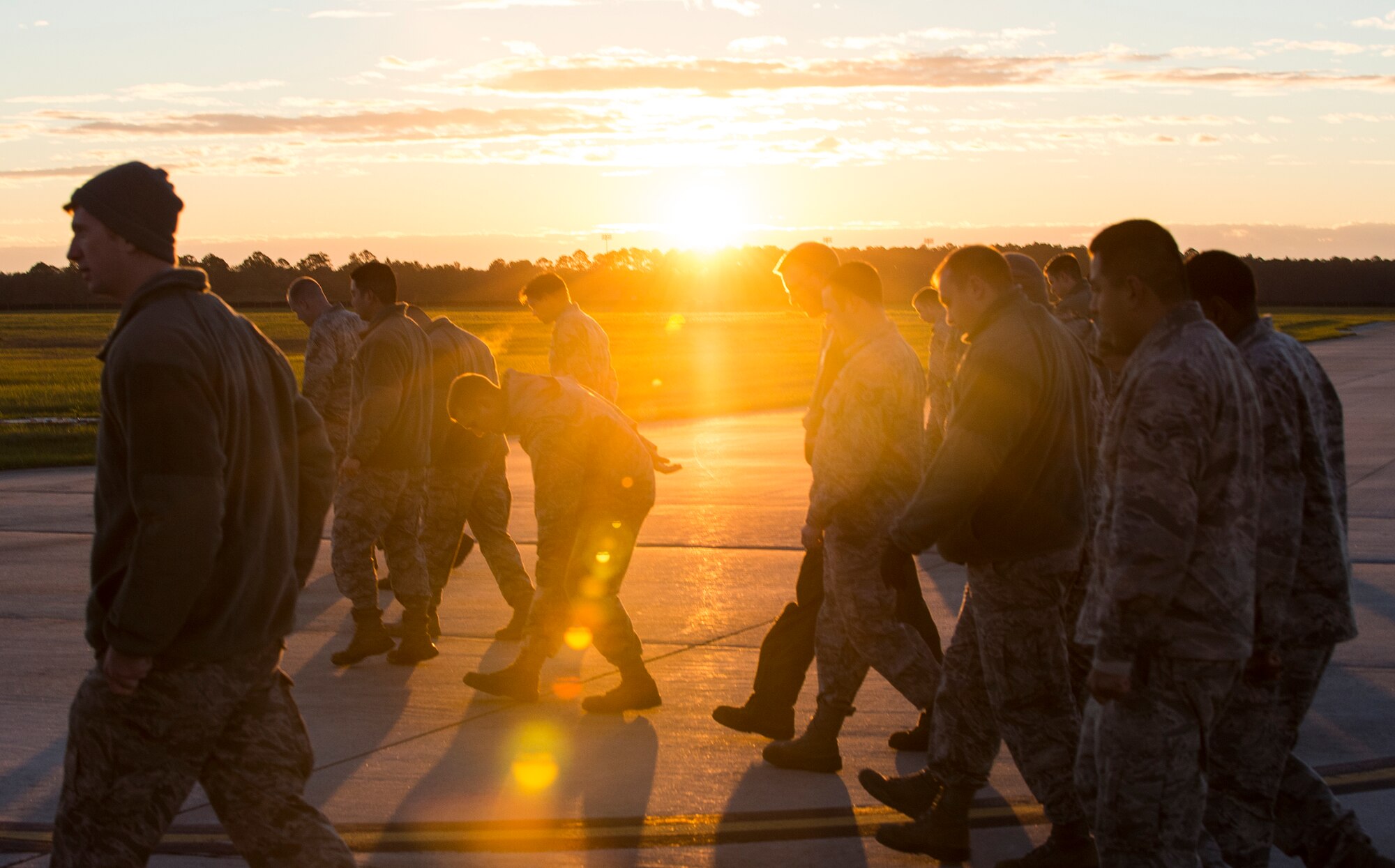 Airmen from the 23d Wing inspect the flightline during the foreign object debris walk, Jan. 4, 2016, at Moody Air Force Base, Ga.  FOD walks are designed to remove anything that could damage the aircraft. (U.S. Air Force photo by Senior Airman Ceaira Tinsley/Released)