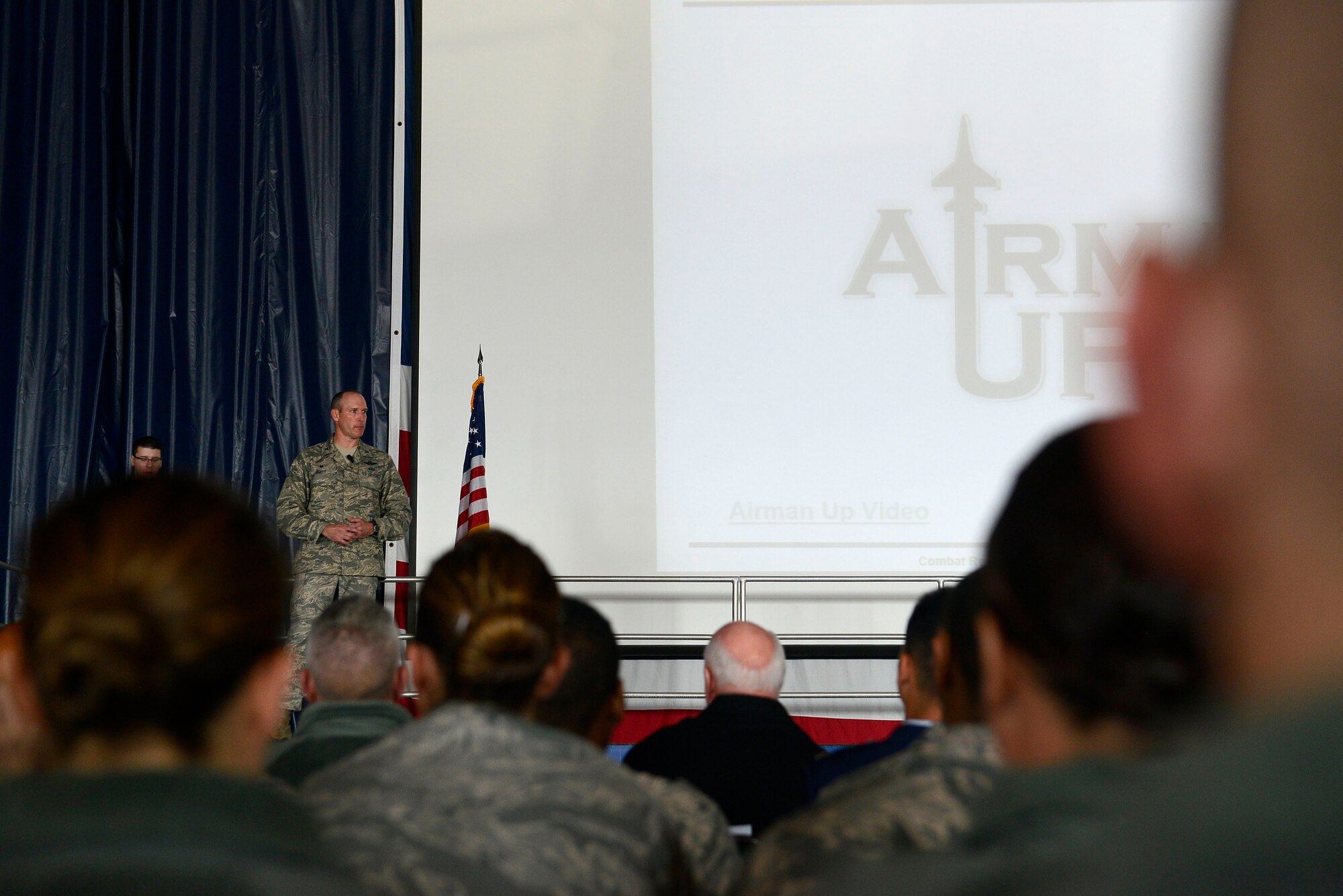 U.S. Air Force Col. Stephen Jost, 20th Fighter Wing commander, addresses 20th FW Airmen during an all-call at Shaw Air Force Base, S.C., Jan. 4, 2016. During the all-call, which marked the one year anniversary of the Airman Up! initiative, Jost recapped accomplishments and recognized Airmen who went above and beyond the call of duty in 2015. (U.S. Air Force photo by Airman 1st Class Christopher Maldonado)