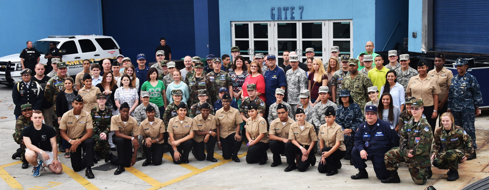 More than 100 members of the 927th Air Refueling Wing and other military affiliated organizations open the American Flag during the singing of the National Anthem at the 2015 St. Petersburg Bowl on December 26, 2015. 