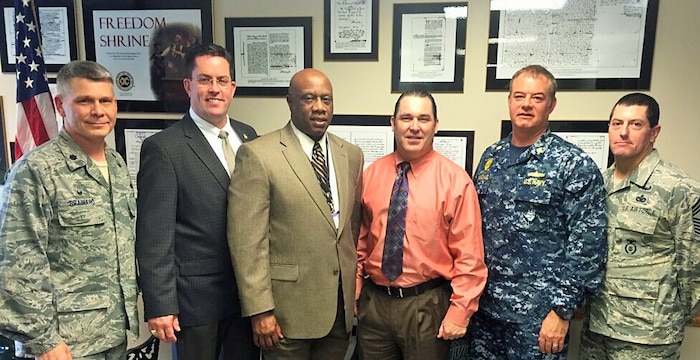Chief Deputy Mike Cochran of Berkeley Co. Sherriff’s Office, Chief Deputy John Clark of Charleston Co. Sheriff’s Office and Deputy Chief David Cheatle of North Charleston Police Department visit with JB Charleston Security Forces leadership to discuss crime prevention efforts. (Courtesy photo)