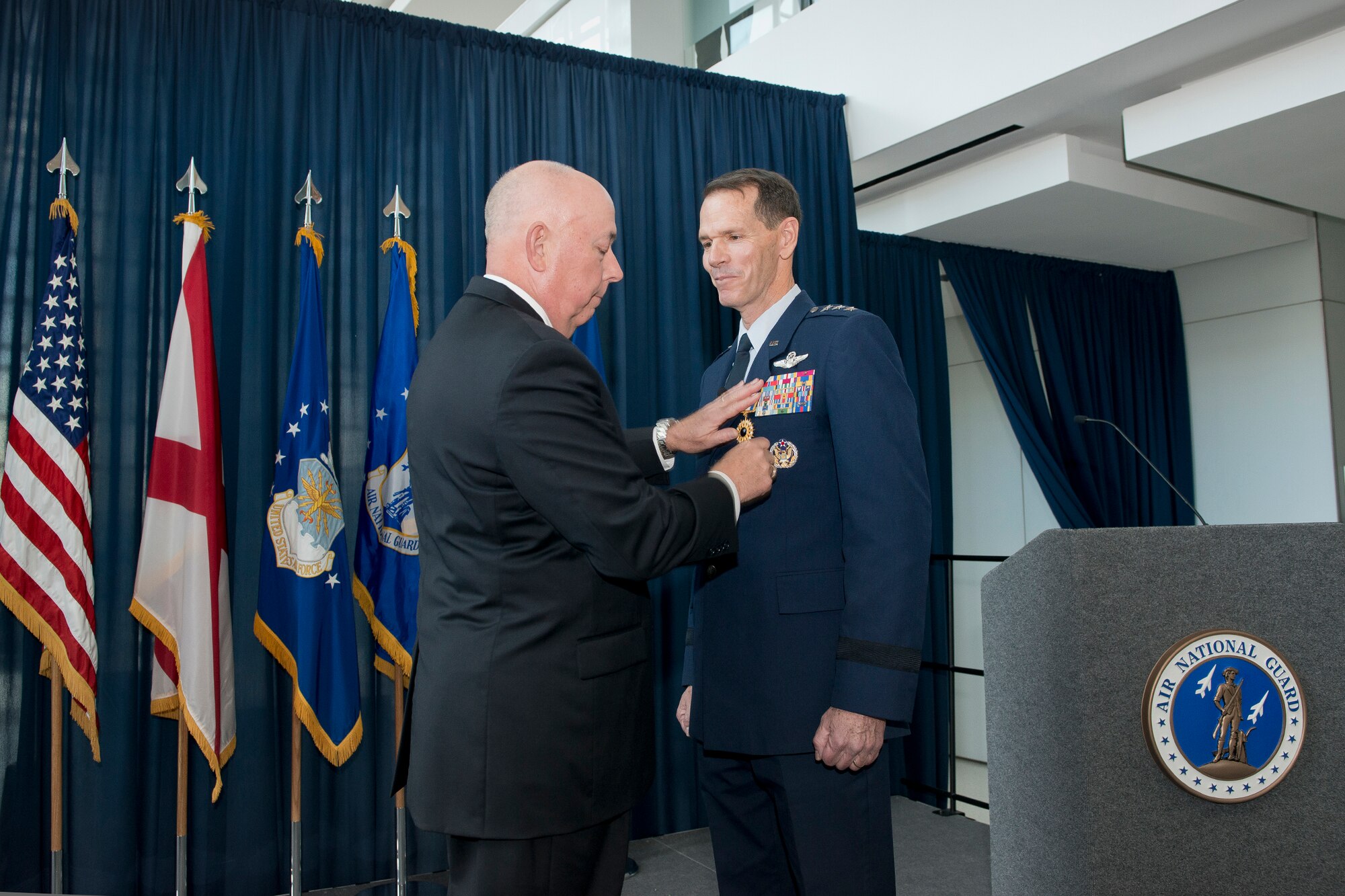 Former Air Force Chief of Staff Gen. T. Michael Moseley pins the Distinguished Service Medal on Lt. Gen. Stanley E. Clarke III during the former’s retirement ceremony at the Air National Guard Readiness Center, Joint Base Andrews, Md., December 18, 2015. Clarke is the 15th director of the ANG and retired after 34 years of service. (Air National Guard photo by Master Sgt. Marvin R. Preston/Released)