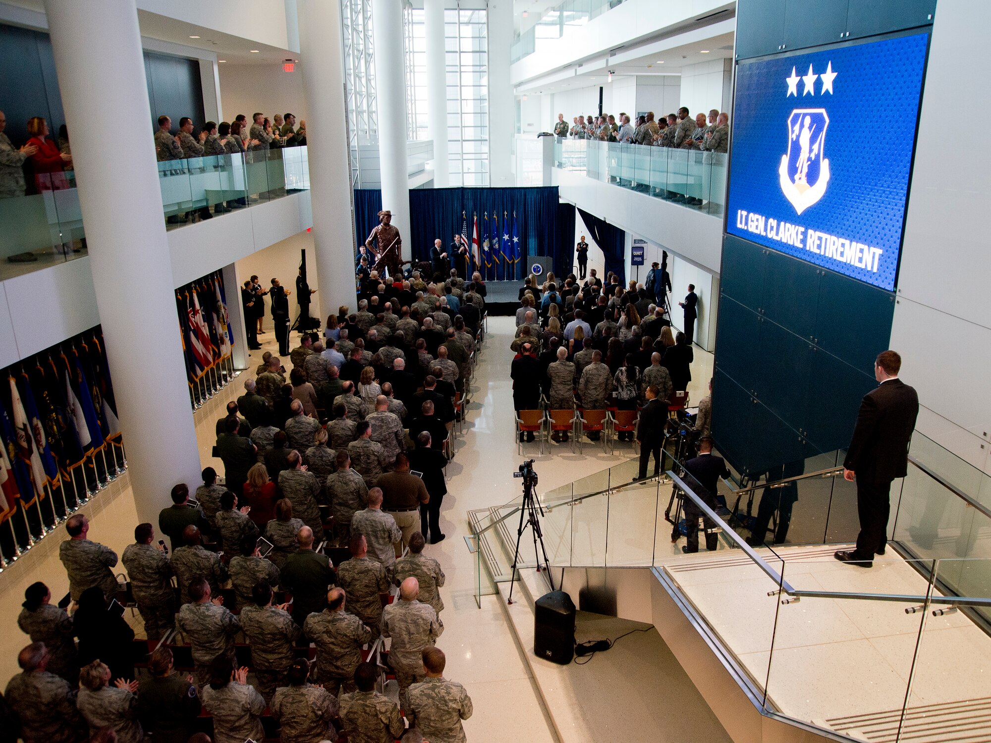 Retired General T. Michael Moseley, former Air Force chief of staff, and Lt. Gen. Stanley E. Clarke, III, Air National Guard director, lead the crowd in the Air Force Song, during Clarke's retirement ceremony held at the Air National Guard Readiness Center on Joint Base Andrews, Md., December 18, 2015. Clarke is the 15th ANG director, and has served in that position since March, 2013. (U.S. Air National Guard photo by Staff Sgt. John E. Hillier/Released)