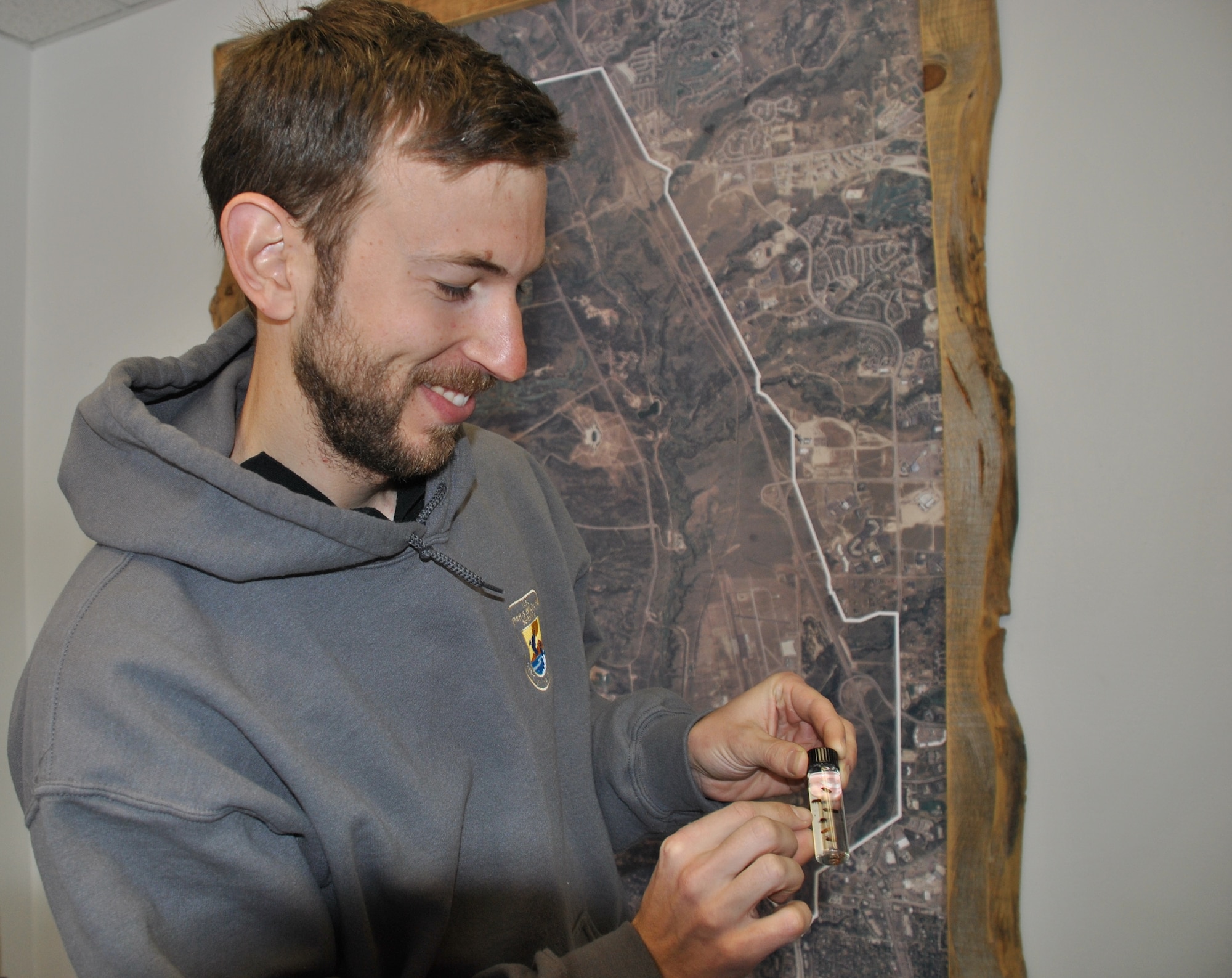 U.S. AIR FORCE ACADEMY, Colorado -- Forester James Donahey shows an ips beetle sample. The beetles were collected on Academy grounds. (U.S. Air Force photo/Carole Chiles Fuller/released) 