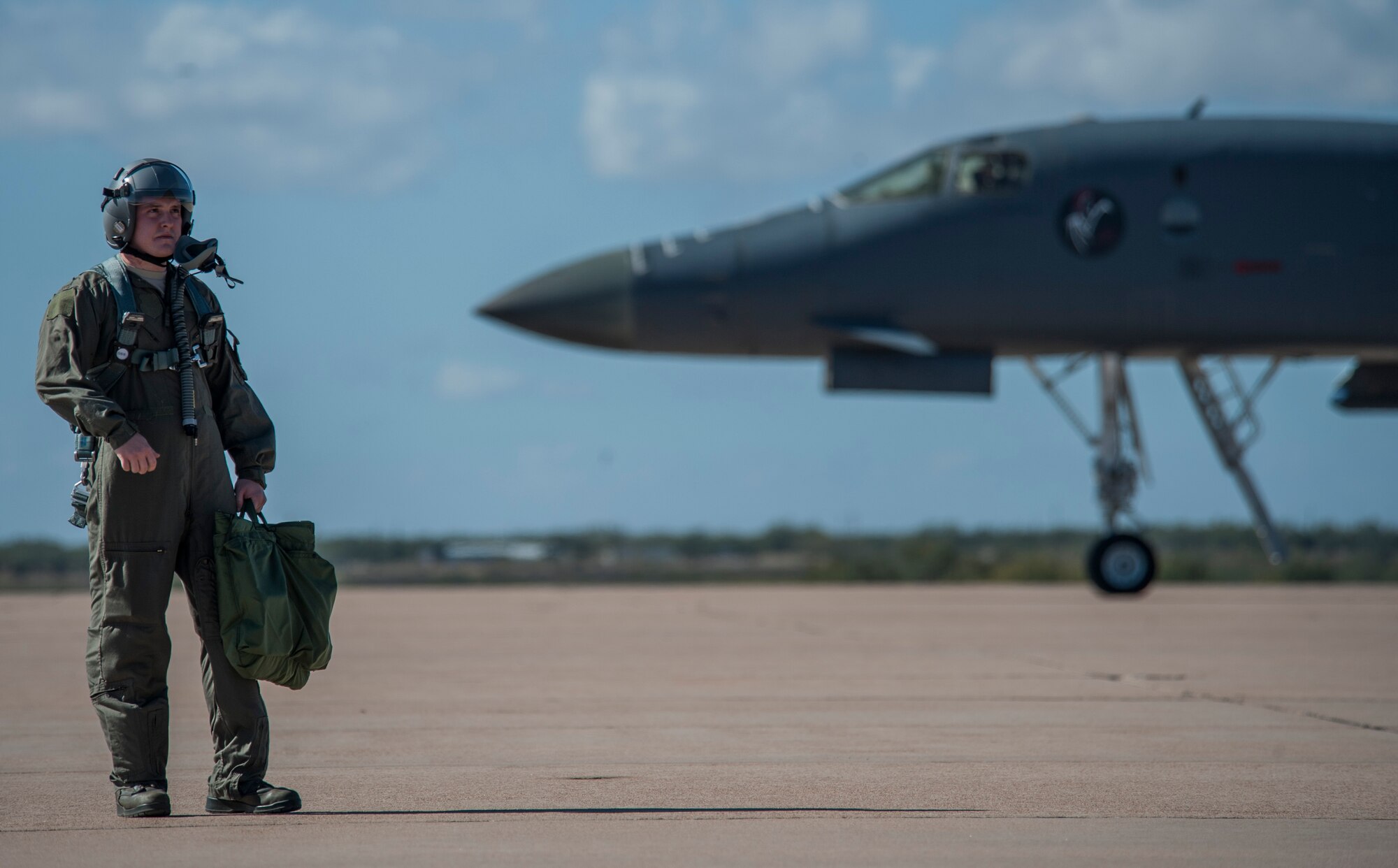 U.S. Air Force Senior Airman Ryan McDonnell, 7th Equipment Maintenance Squadron aerospace ground equipment journyman, waits to board a B-1B Lancer Nov. 20, 2015, at Dyess Air Force Base, Texas. McDonnell was nominated to fly as a passenger as part of an incentive program rewarding superior-performing Airmen. (U.S. Air Force photo by Airman Quay Drawdy/Released)