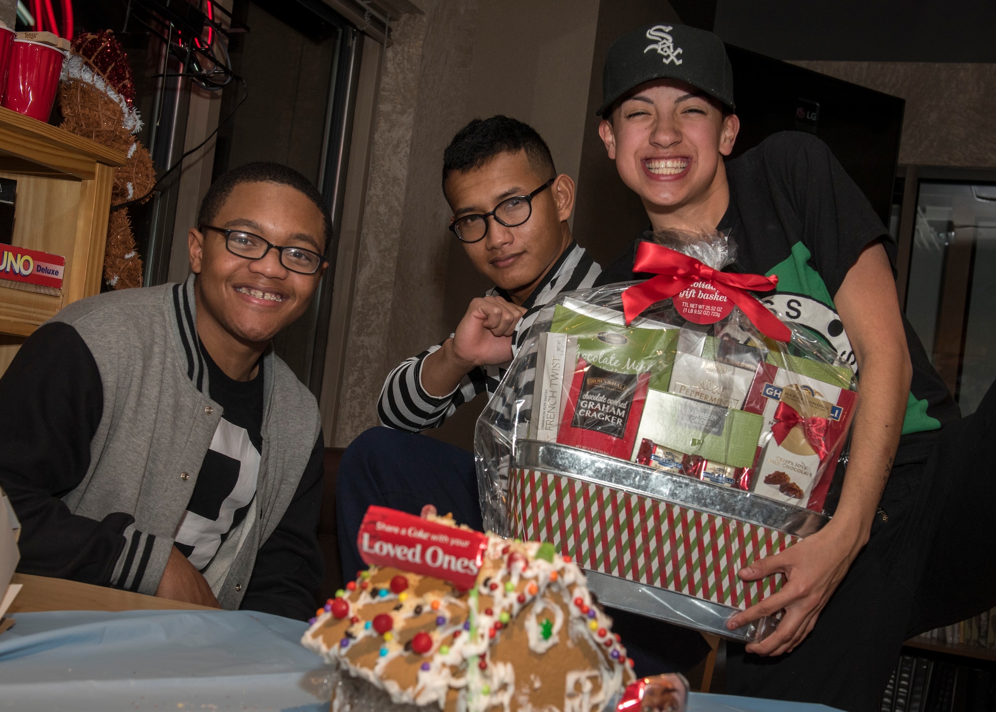 PETERSON AIR FORCE BASE, Colo. – Airmen enjoy the aftermath of the Peterson Chapel’s annual Gingerbread House Building Competition at the Eclipse Café on Dec. 16, 2015. The winning team was that of Airman 1st Class Hersey Mayo, 21st Aerospace Medicine Squadron; Airman Donah Schroeder, 21st Dental Squadron; and Airman 1st Class Dominique Beltran, 21st AMDS. (U.S. Air Force photo by Senior Airman Rose Gudex)