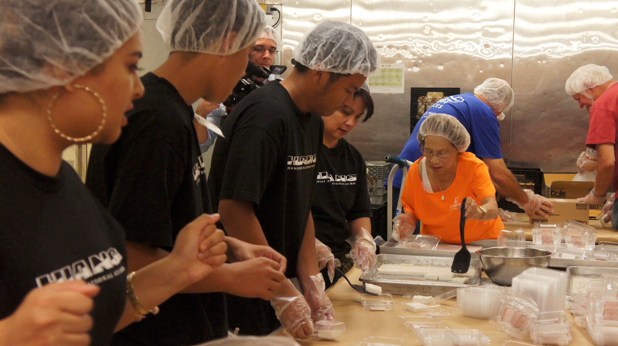 Members of the Hawaii Air National Guard joined 200 Lanakila Meals on Wheels volunteers in preparing over 700 meals for home bound elderly, Dec. 25, 2015, Honolulu. Members of the HIANG have been assisting in meal preparation and delivery on Thanksgiving and Christmas mornings for more than 10 years. Lanakila Pacific is a nonprofit organization that builds independence for thousands of people living challenged lives. (U.S. Air National Guard Photo by Tech. Sgt. Andrew Jackson/released)
