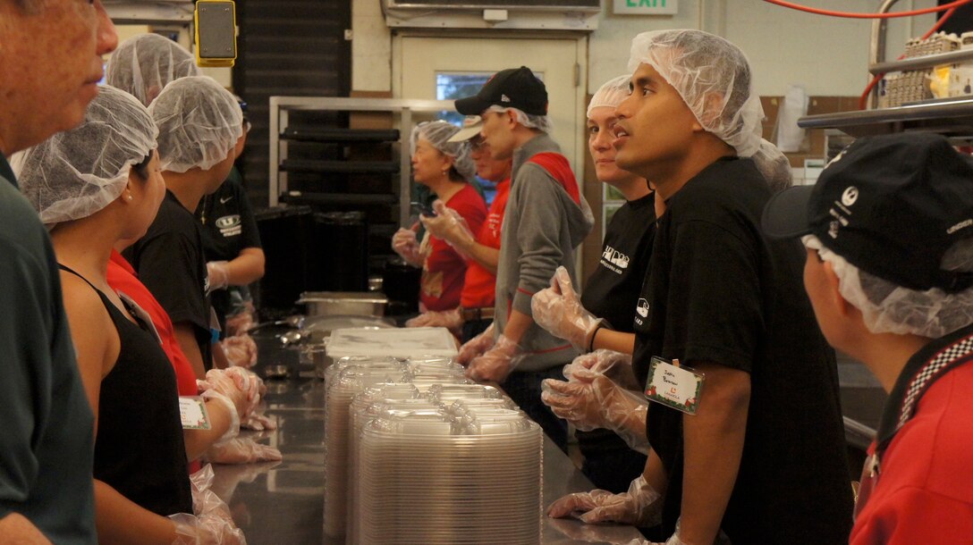 Members of the Hawaii Air National Guard joined 200 Lanakila Meals on Wheels volunteers in preparing over 700 meals for home bound elderly, Dec. 25, 2015, Honolulu. Members of the HIANG have been assisting in meal preparation and delivery on Thanksgiving and Christmas mornings for more than 10 years. Lanakila Pacific is a nonprofit organization that builds independence for thousands of people living challenged lives. (U.S. Air National Guard Photo by Tech. Sgt. Andrew Jackson/released)
