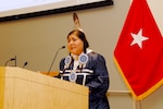 Mary Phillips of the Laguna Pueblo Tribe of New Mexico and Omaha Tribe of Nebraska addresses the audience of Defense Logistics Agency Troop Support and Naval Support Activity Philadelphia employees Dec. 1 during the National American Indian Heritage Month event. Photo by Ed Maldonado