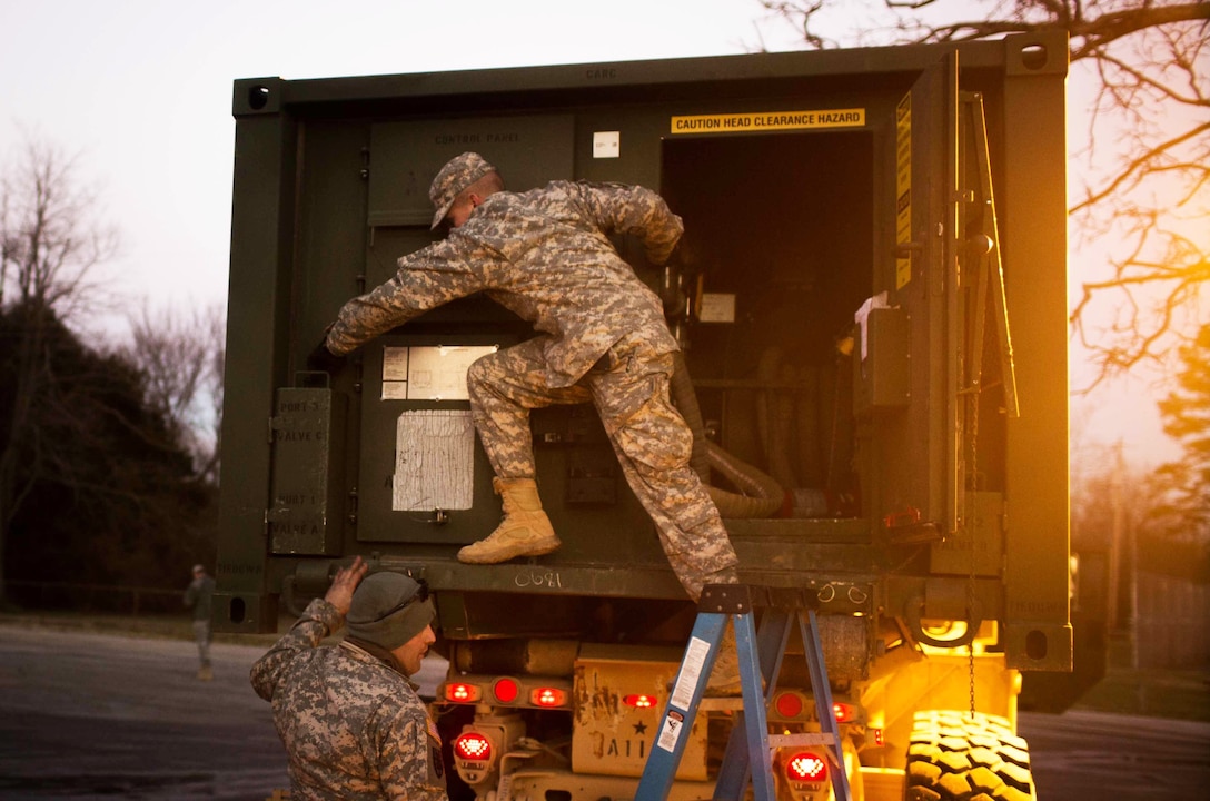 Soldiers work to bring pure water to citizens in High Ridge, Mo., Jan. 3, 2016. The mission will supply area residents with potable water, which is currently unavailable due to flooding. The soldiers are assigned to the 334th Brigade Support Battalion. U.S. Army photo by Cpl. Harold Flynn
