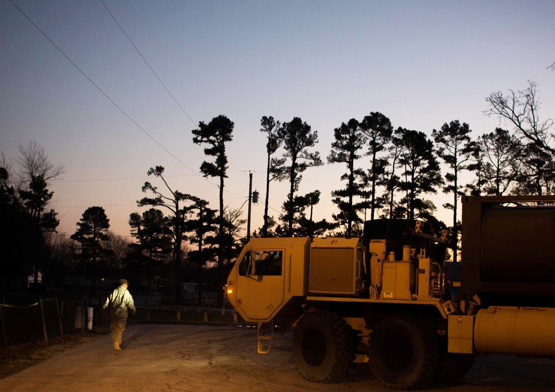Soldiers work into the night on a water purification mission in High Ridge, Mo., Jan. 3, 2016. U.S. Army photo by Cpl. Harold Flynn