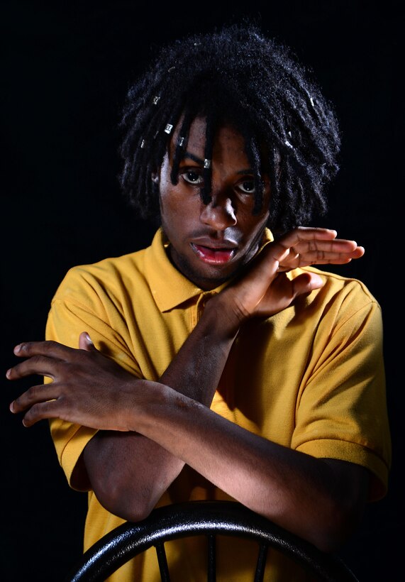 Kendall L. Mountain, a mess attendant at the Freedom Inn dining facility at Fort Meade, Md., shows scars on his arms. Mountain, who is also a student at Meade Senior High School, broke both arms and one leg during a 2012 car accident that killed his older brother.