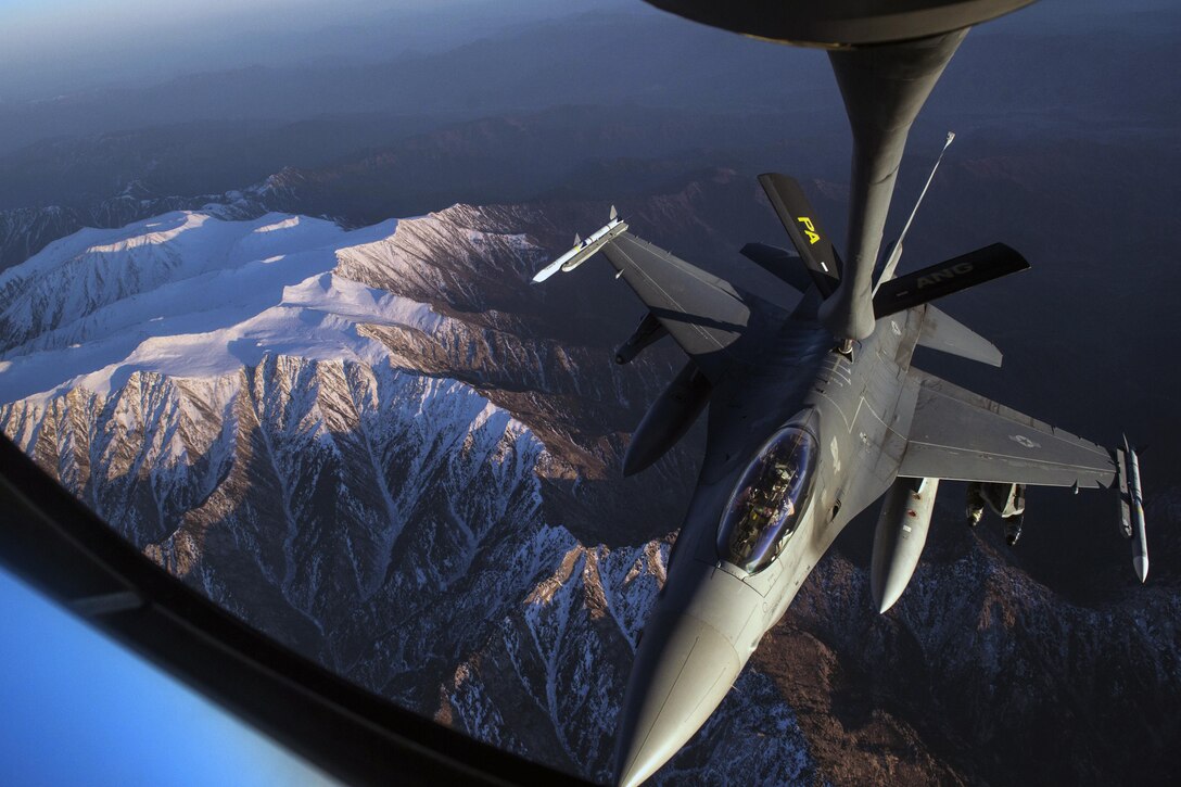 A U.S. Air Force F-16 Fighting Falcon receives fuel from an Air Force KC-135 Stratotanker over Afghanistan, Dec. 29, 2015. U.S. Air Force photo by Staff Sgt. Corey Hook